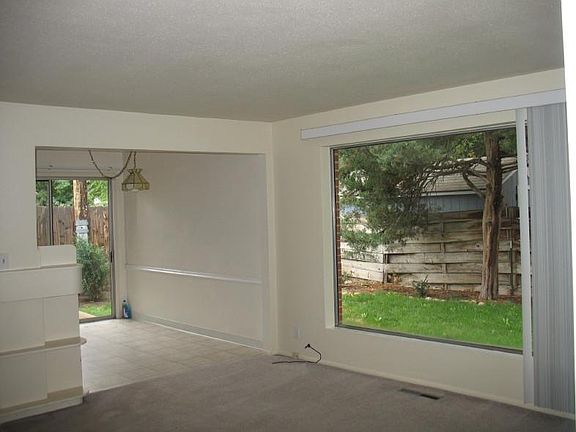 Large living room and dining room. Shaded Patio is accessed off dining room through sliding glass door.