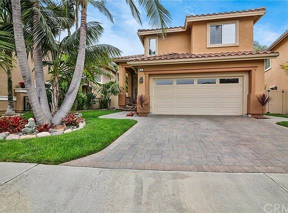 Front Yard with Brick 5 Pattern Pavers - Driveway and Walkway. Mature King Palm Trees and Lush Tropi