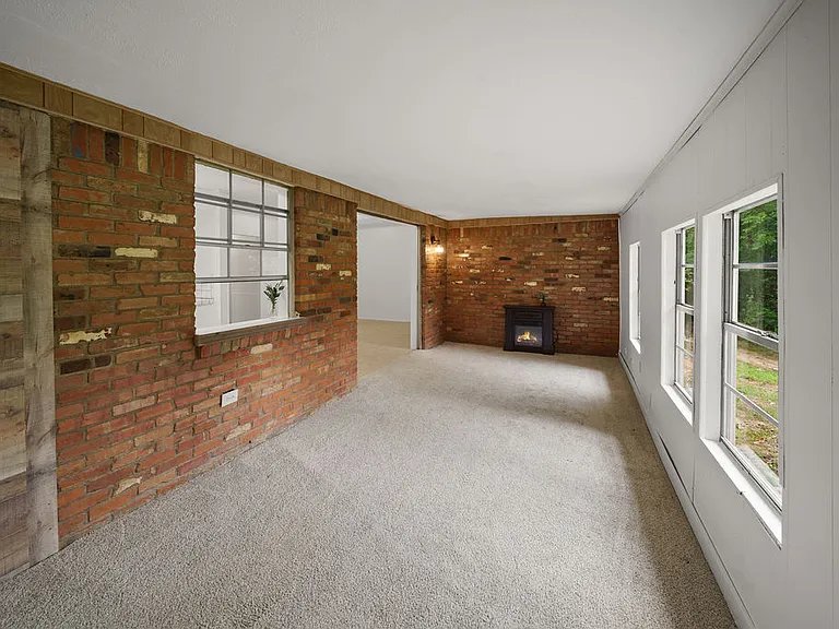 Bonus room looking out to the back yard, was an outdoor porch, now fully enclosed