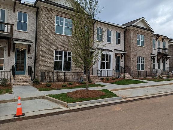 REPRESENTATION OF THE EXTERIOR OF THE BUILDING. Three sides brick. Great streetscape.