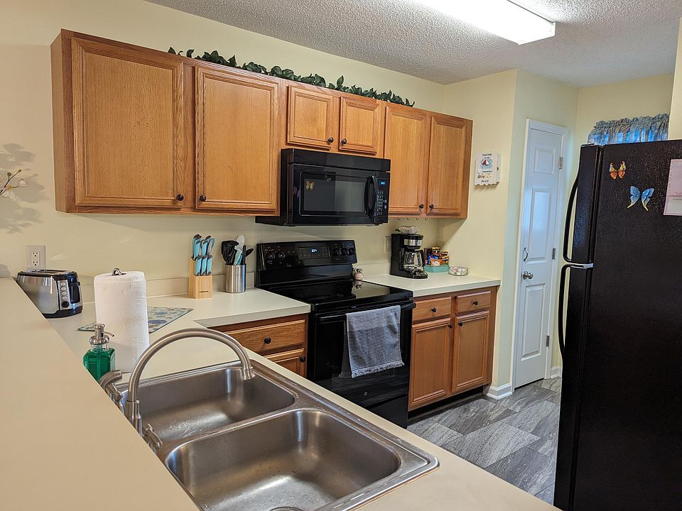 Full kitchen with coffee maker and toaster.