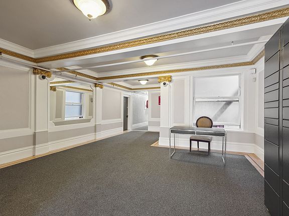 Lobby with a front desk and an Amazon Hub Locker