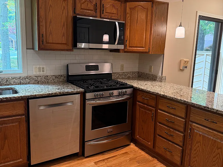 Bosch dishwasher, new microwave oven, gas range. Lots of cabinet storage.