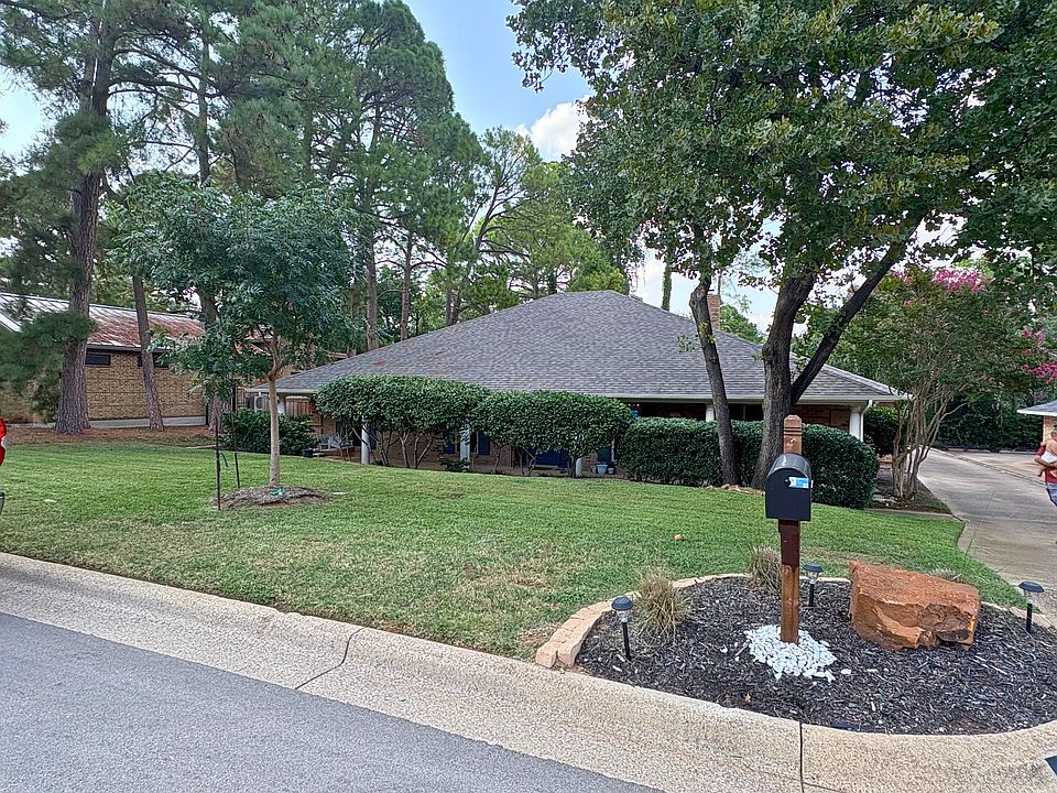 Exterior of the home which includes a beautiful covered porch with porch swing!