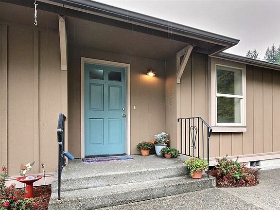 Generous front porch leads to designated entryway.