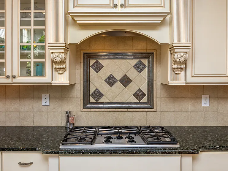 Kitchen-aid gas stove with 5 burners, Bosch Dishwasher, double ovens, Disposal, and touch faucet