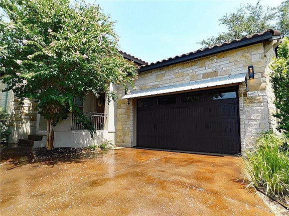 Concrete Tile Roofing and Two-Car Garage with a Mini-Split Air Conditioning Unit