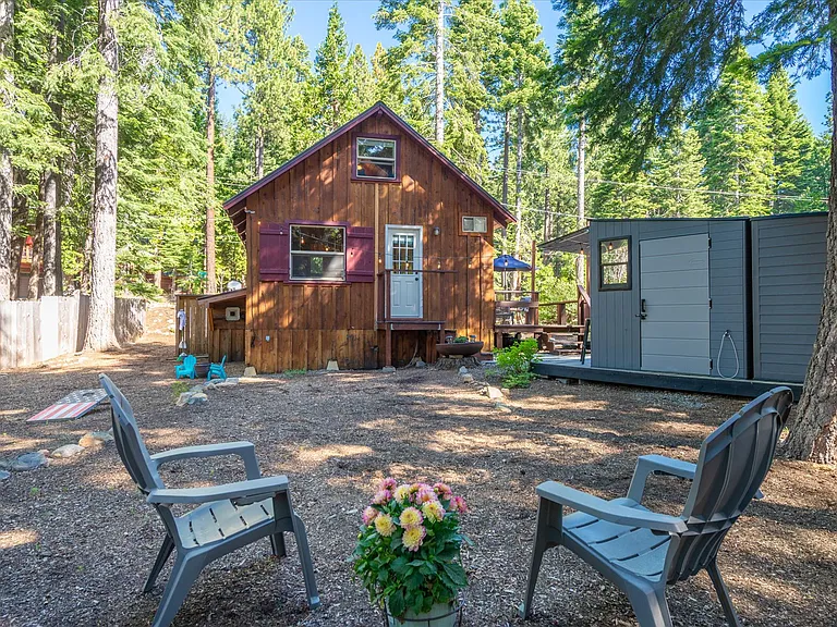 Rear view of cabin (note that shed and outdoor furniture only available during summer months)