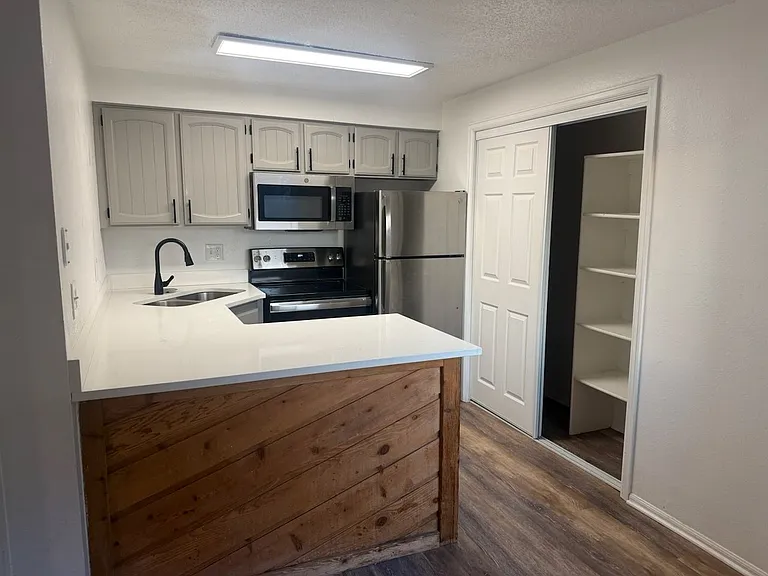 Cozy kitchen with lots of storage.