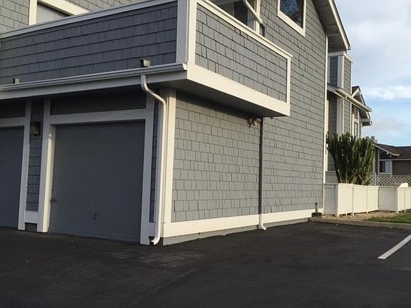 1 car garage with spaces next to it