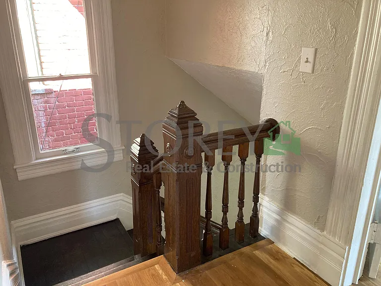 Top of stairs on second floor