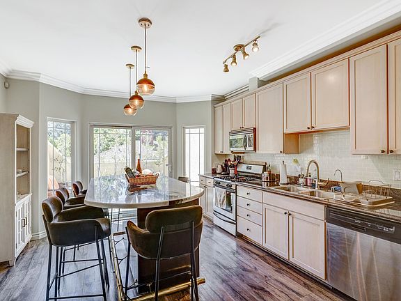 Kitchen with large marble island