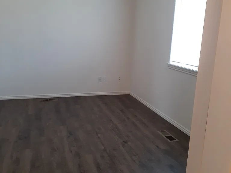 Looking at master bedroom from bathroom