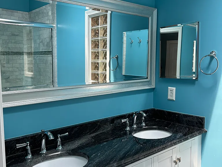 Primary bathroom with double sink vanity.