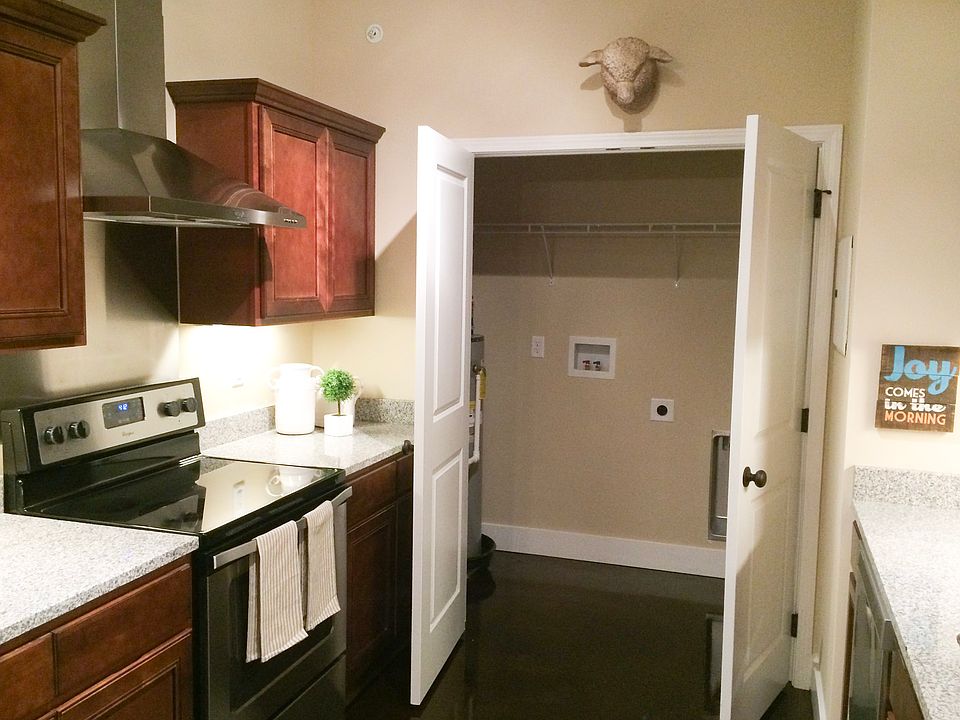 Spacious kitchen with stainless appliances and granite countertops