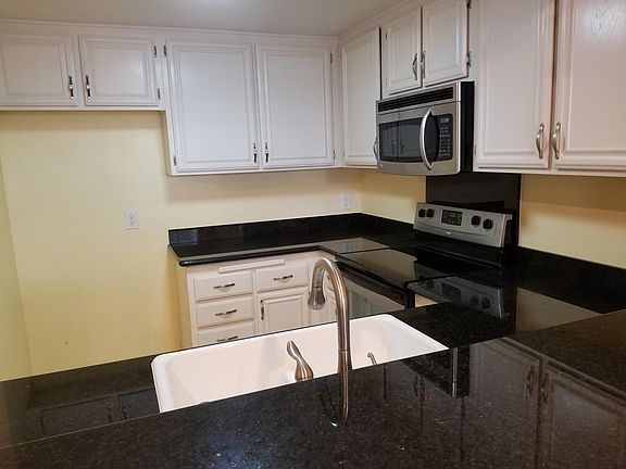 Blues in the Night granite counter tops. Space for fridge. Fridge is not included