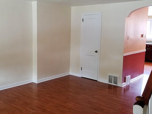 Living room with closet. Old photo, has been painted