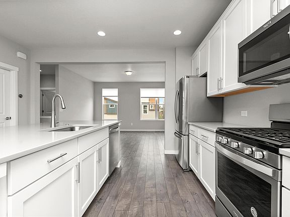 Gourmet Kitchen with quartz counter tops and stainless steel appliances