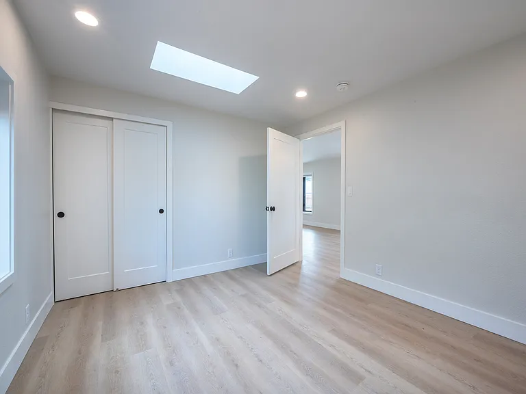 Bedroom #2 , closet organizers w/ 2 skylights and large window.