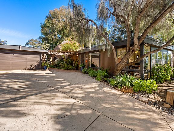 Spacious parking area with easy access to the home's entrance and attached two-car garage.