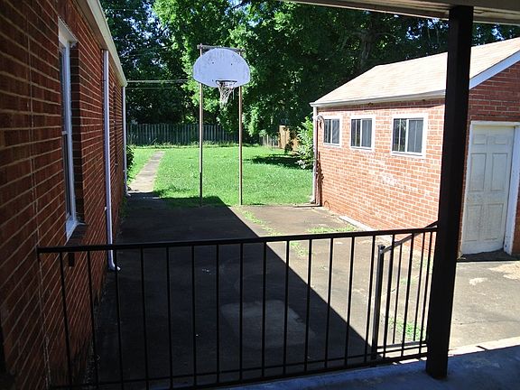 another view of back yard and garage