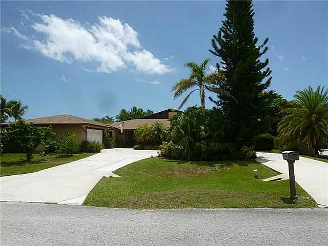 Exterior Front. An amazing 4 bedroom 3.5 bath pool home with a paradise all your own