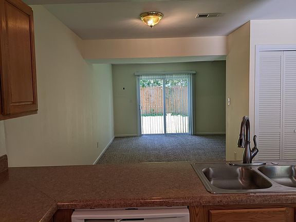 View from Kitchen through Dining Area to Living Room