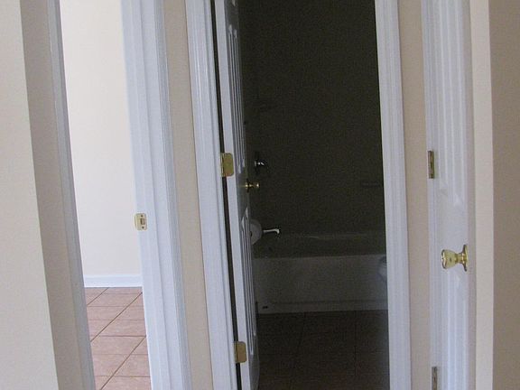 Hallway to secondary room, bathroom & closet