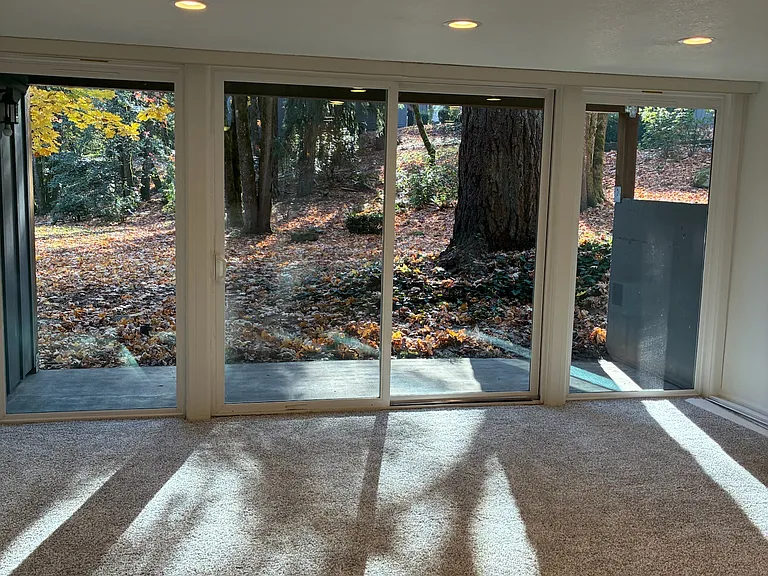 Living room view to deck and forest