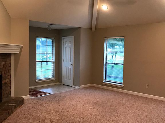 The entry has tiled flooring and a closet for storage. The Living Area has 12' vaulted ceiling with beams and ceiling fans_. Lots of light with recessed lighting and three windows. Open concept into dining and kitchen area.
