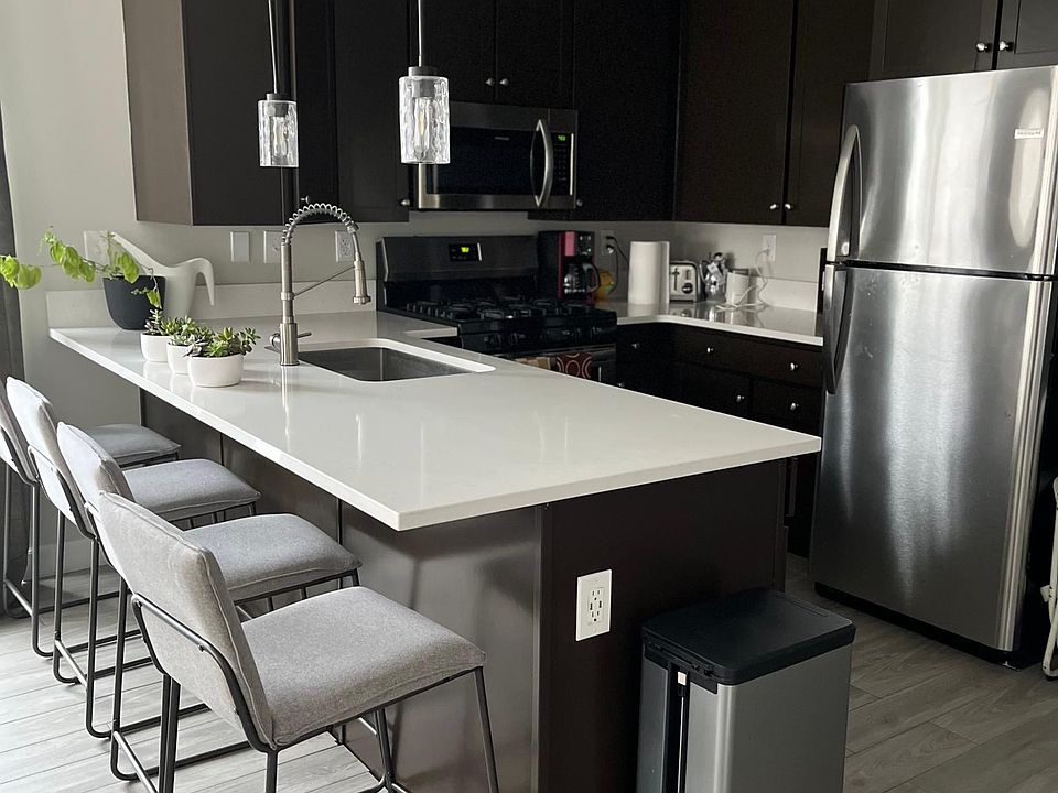 Fully-equipped kitchen with new stainless-steel dishwasher, stove, frig.