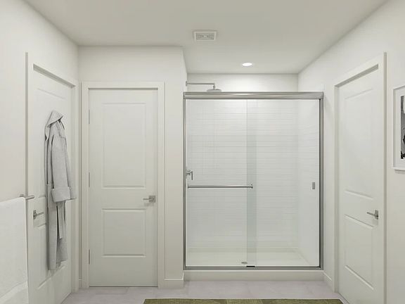 Primary bath with glass shower enclosure