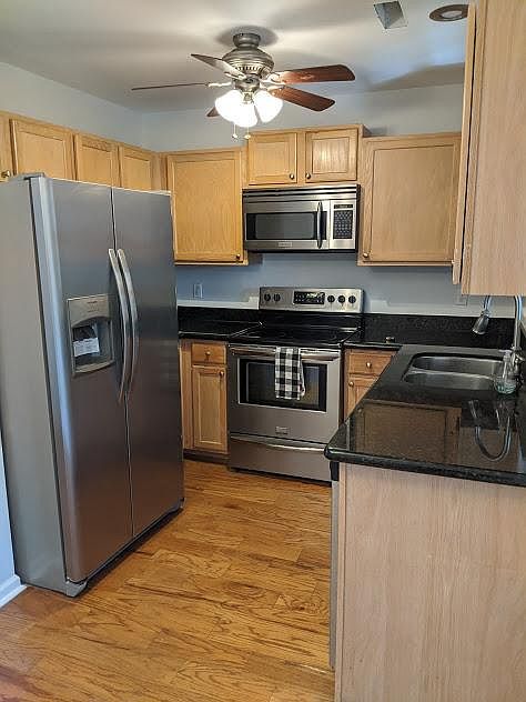 Updated upgraded kitchen features granite counter tops, and stainless steel appliances.