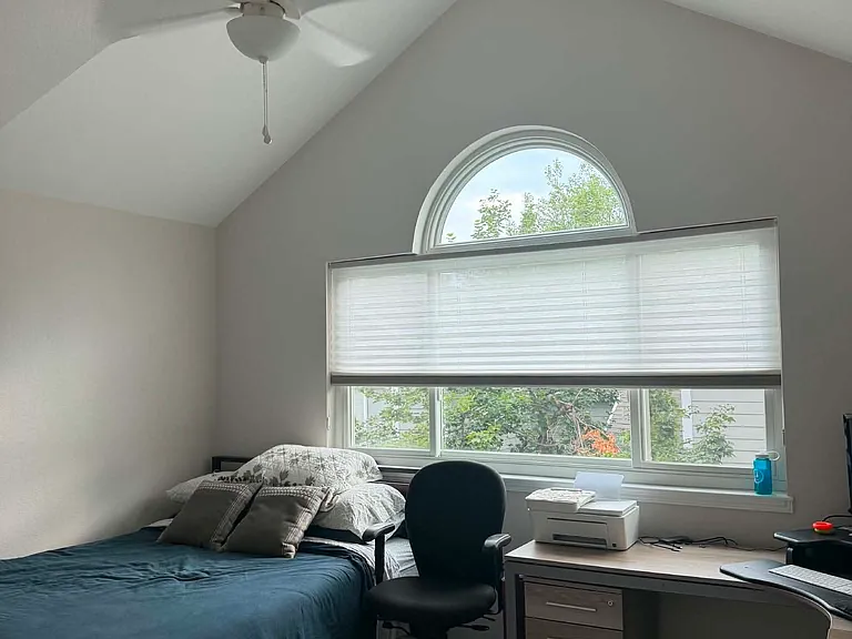 Private bedroom with high vaulted ceilings and lots of natural light. This furniture belongs to my current tenant, but I would be happy to discuss furnishing the room if needed.