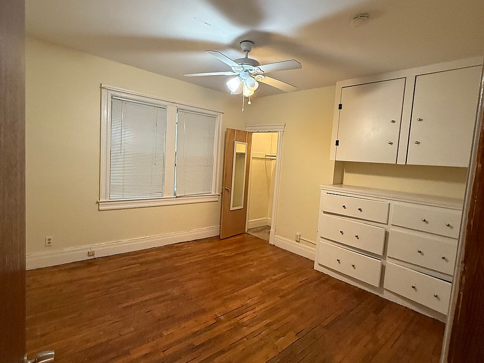Bedroom with Built ins and Ceiling fan