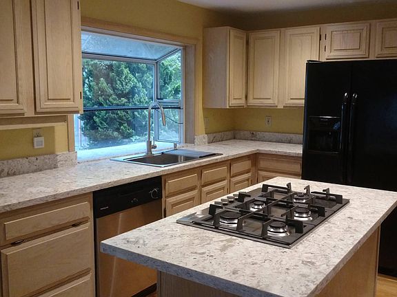 Remodeled kitchen with brand new Quartz countertop, cooktop,