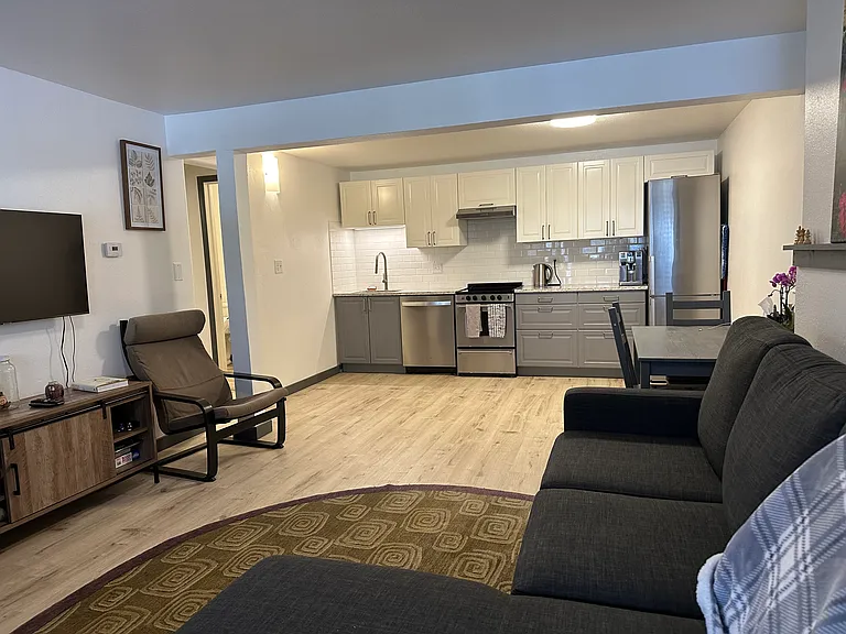 Shows open living room and kitchen