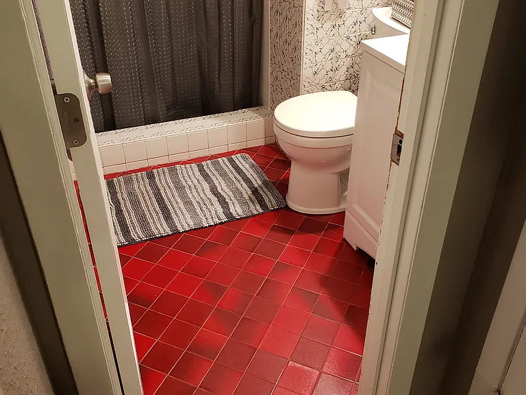 Shower only bathroom, there is a closed closet in the hall by kitchenette to the right of bathroom.
