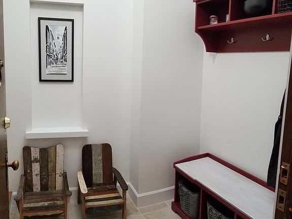 Large foyer. 10' long closet off of the foyer has built-in shelves and hanging.