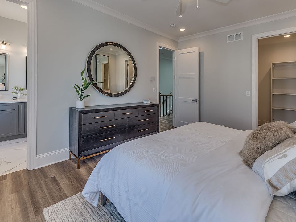 Spacious bedrooms with attached bathrooms.
