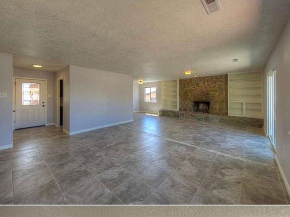 Living room with Fireplace/sliding door to back fenced yard.