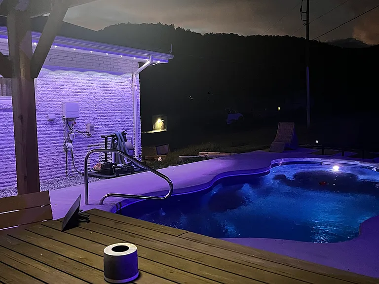 Pool with outdoor lighting. Enjoy summer days grilling under the gazebo