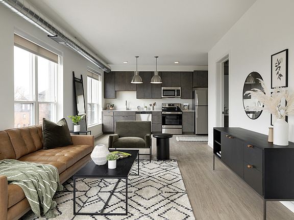 Lots of natural light pours through the windows and into this living/kitchen