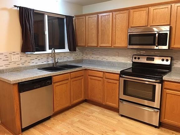 Kitchen with Granite Counter Top and Stainless Steel Appliances.