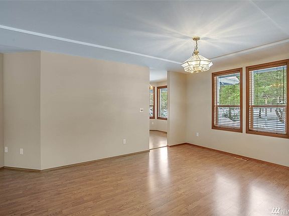 Adjacent to the living room is the lovely formal dining room. Both spaces are open to each other and make for great entertaining. 