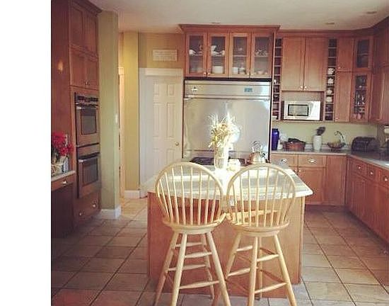 Cherry cabinets to the ceil