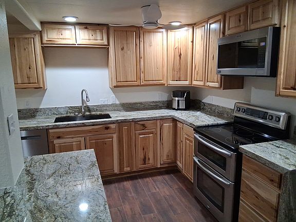 Kitchen, all new cupboards, granite countertops with waterfall edges and island, farmhouse sink, stainless steel maytag appliances include dishwasher, microwave, french door refrigerator with ice & water and double oven electric stove.