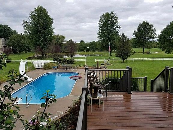 In ground pool with slide. 