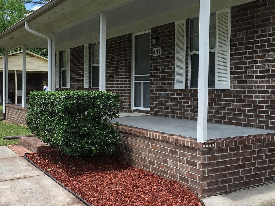 Front of house has a covered porch
