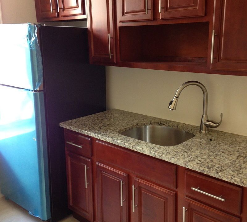Kitchen features stainless steel appliances, and new granite